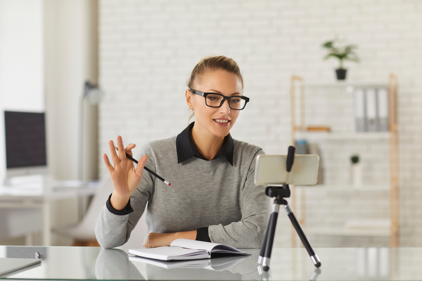 Remote Teacher or Business Coach Saying Hello to Her Students in a Virtual Lesson